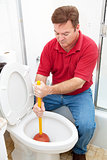 Man Uses Plunger on Clogged Toilet