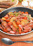 Fried potatoes with meat and vegetables
