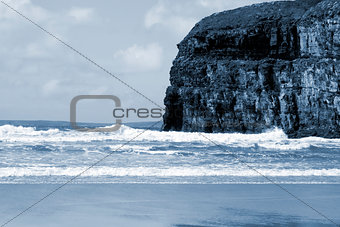 Atlantic waves crashing on Ballybunion beach and cliffs