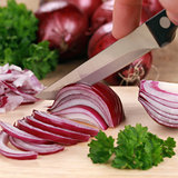 Preparing food: cutting a red onion