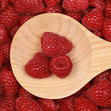 Raspberries on a wooden spoon