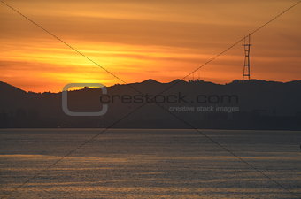 Sutro Tower admires the sunset over San Francisco bay