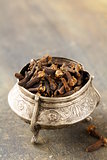 Dried spice cloves on a wooden table