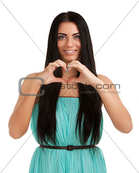 Young woman forming heart shape with hands