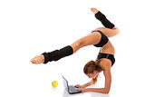Flexible gymnast with laptop and apple