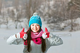 Smiling girl on snow winter background 