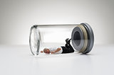Senior man trapped in a glass jar