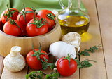 fresh vegetables ( tomato, mushrooms, garlic) and olive oil