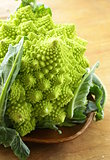 head of cabbage romanesco on wooden plate
