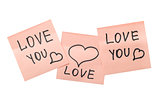 three pink sticky notes with hearts