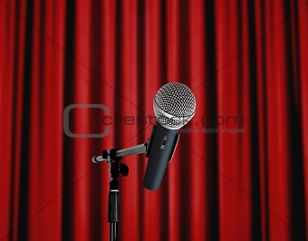 Microphone standing over red curtain