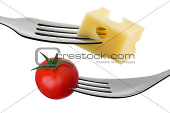 tomato and cheese on a fork against white background