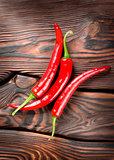 Chili on a wooden background