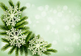 Christmas green background with christmas tree branches and snow