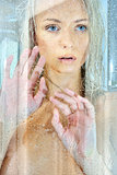 Beatiful blonde naked woman in a shower.