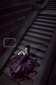 Beautiful woman in violet dress
