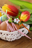 decorated eggs and spring flowers tulips - symbols of Easter holiday
