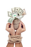 Prisoner of profit - man holding bag of money
