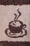 Coffee beans on burlap surface