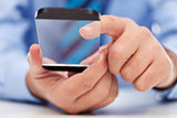 Touchscreen gadget in businessman hands