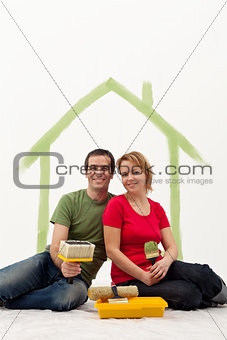 Couple in their new home painting