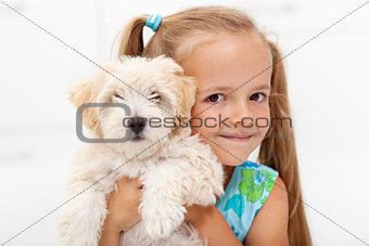 Little girl with her fluffy dog