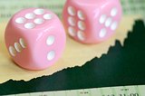Two dices on a stock market graph concept of investment and finance