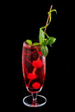 Alcohol red drink, cocktail with mint, cherry, isolated black