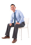 Full body Asian business man sitting