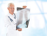 Asian senior doctor checking on x-ray image