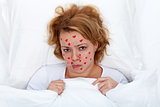 Lovesick woman laying in bed