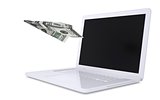 White laptop and the plane of dollars