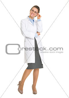 Full length portrait of smiling ophthalmologist doctor with glas