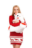 Blonde woman posing with toy bear