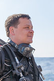 Portrait shot of a scuba diver from the side