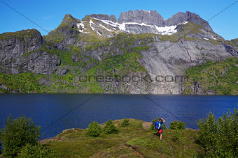 Hiker by fjord in Norway