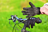 Mountain biker wears old gloves