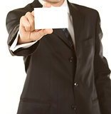 Business man handing a blank business card 