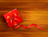 Holiday background with gift box and red bow. Vector illustratio