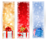 Three christmas banners with gift colorful boxes and snowflakes. Vector illustration
