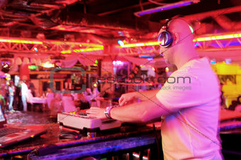 DJ behind the control panel