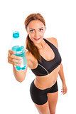 Beautiful smiling fitness woman holding plastic water bottle