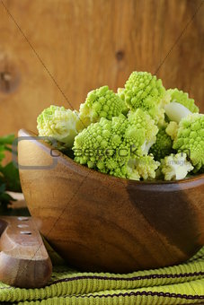 romanesco cabbage cut in a wooden bowl