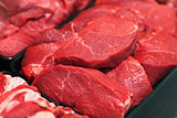 Raw red meat on shelf in market