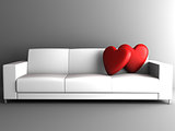 red heart on white sofa