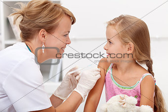 Brave little girl receiving injection