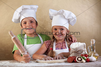 Happy kids making pizza togheter