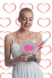blonde girl reads valentine postcard