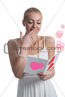 surprised blonde girl reads valentine postcard 