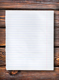Lined paper on dark table